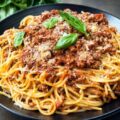 Spaghetti Bolognese with Cheese and a protein (Chicken, Beef, Goat, Fish)