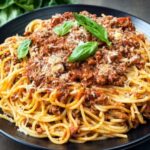 Spaghetti Bolognese with Cheese and a protein (Chicken, Beef, Goat, Fish)