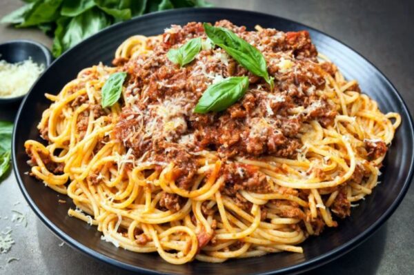Spaghetti Bolognese with Cheese and a protein (Chicken, Beef, Goat, Fish)